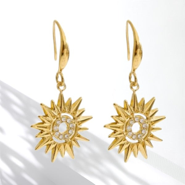 Close-up of waterproof hammered drop dangle earrings in gold, textured with a modern shine, designed for everyday and special occasions.