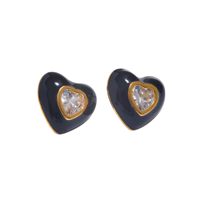 Heart-shaped earrings with black enamel and clear gemstones on a white background