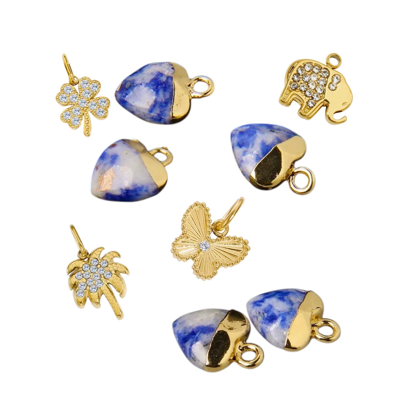 Collection of gold and blue stone charms on a white background