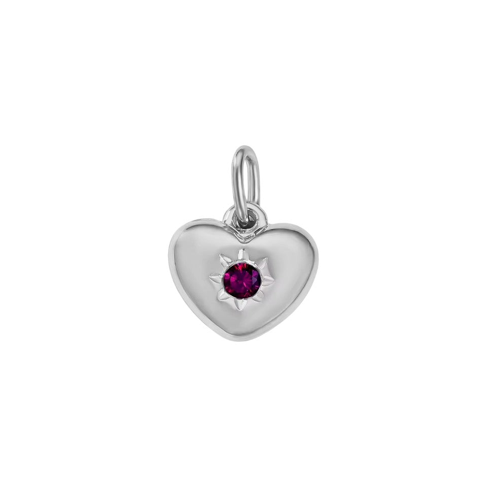 Silver heart-shaped pendant with a red gemstone on a white background