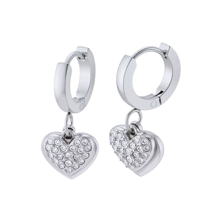 A pair of silver huggie hoop earrings with dangling heart charms encrusted with clear rhinestones, shown on a plain white background.