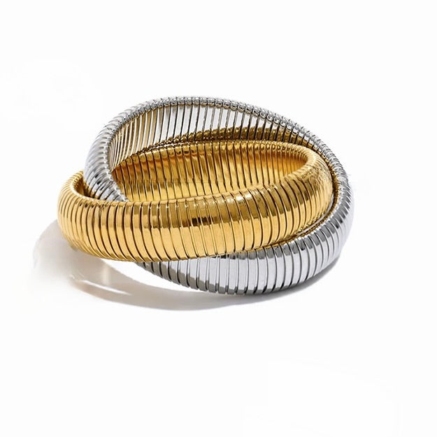 Two-toned gold and silver bracelet on a white background