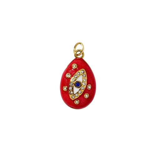 Red pendant with gold accents and a blue gemstone on a white background