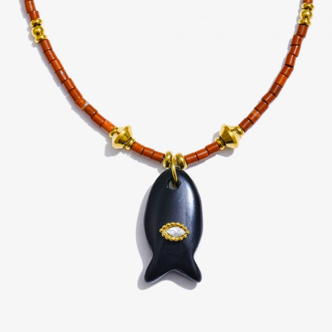 Necklace with a black fish-shaped pendant on a white background