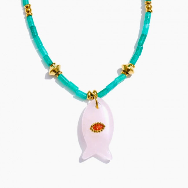 Necklace with turquoise beads and a fish-shaped pendant on a white background