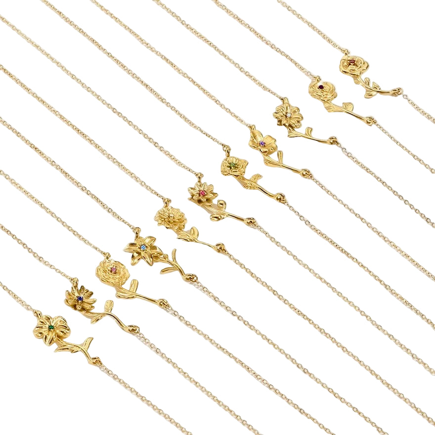 Gold necklaces with floral pendants on a white background