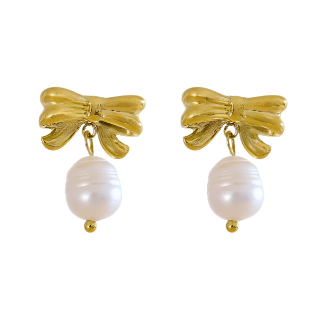 Gold bow earrings with pearl drops on a white background