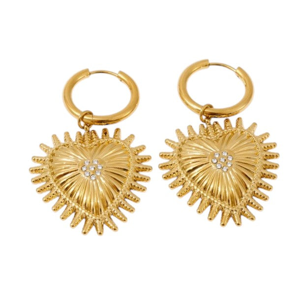 A pair of gold hoop earrings with textured, sunburst heart-shaped pendants featuring a small clear crystal flower at the center, shown on a plain white background.