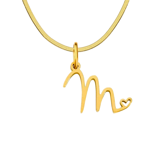 Gold necklace with a 'M' pendant on a white background