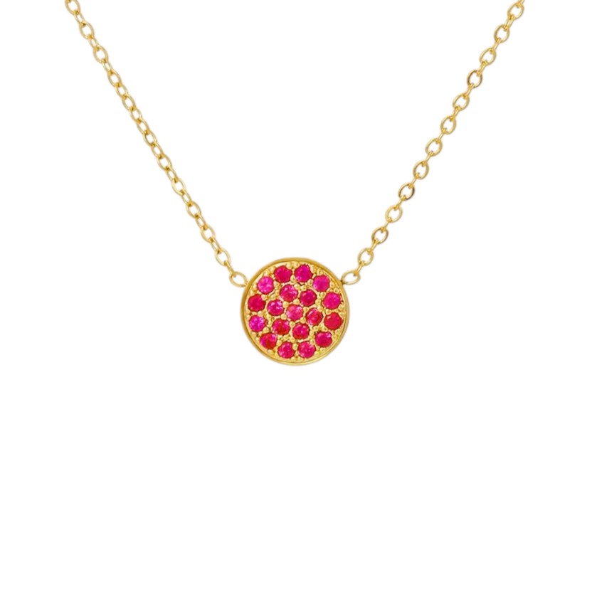 Gold necklace with a circular pendant featuring pink stones on a white background
