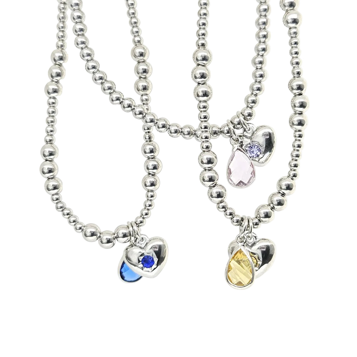 Two silver beaded necklaces with heart-shaped charms on a white background