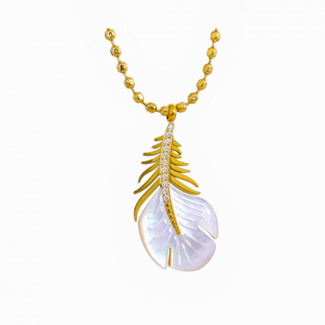 Gold and white feather-shaped pendant on a gold chain against a white background