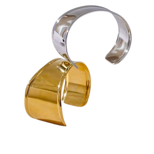 Gold and silver cuff bracelet on a white background