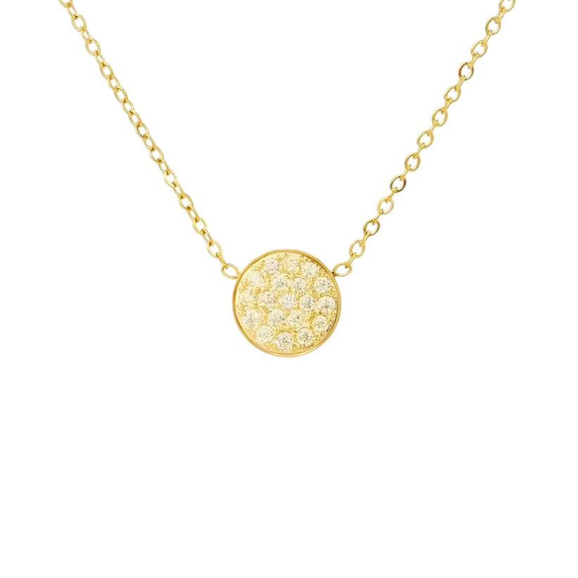 Gold necklace with a round, yellow stones studded pendant on a white background