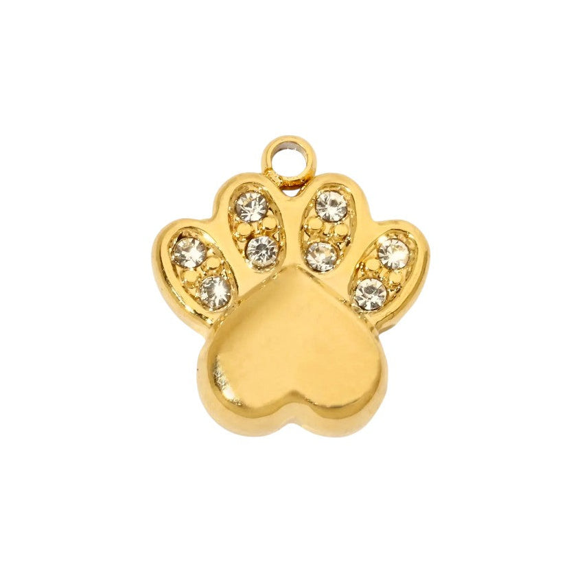 Gold paw print charm with embedded crystals on a white background