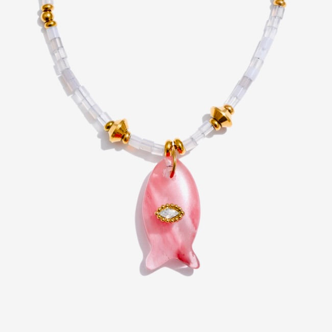 Necklace with a pink pendant on a white background