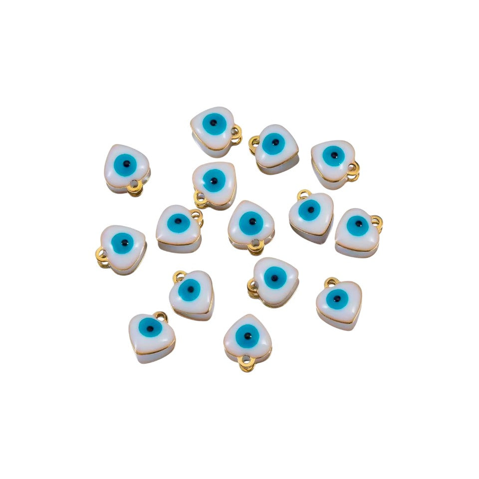 Heart-shaped evil eye charms with gold loops on a white background
