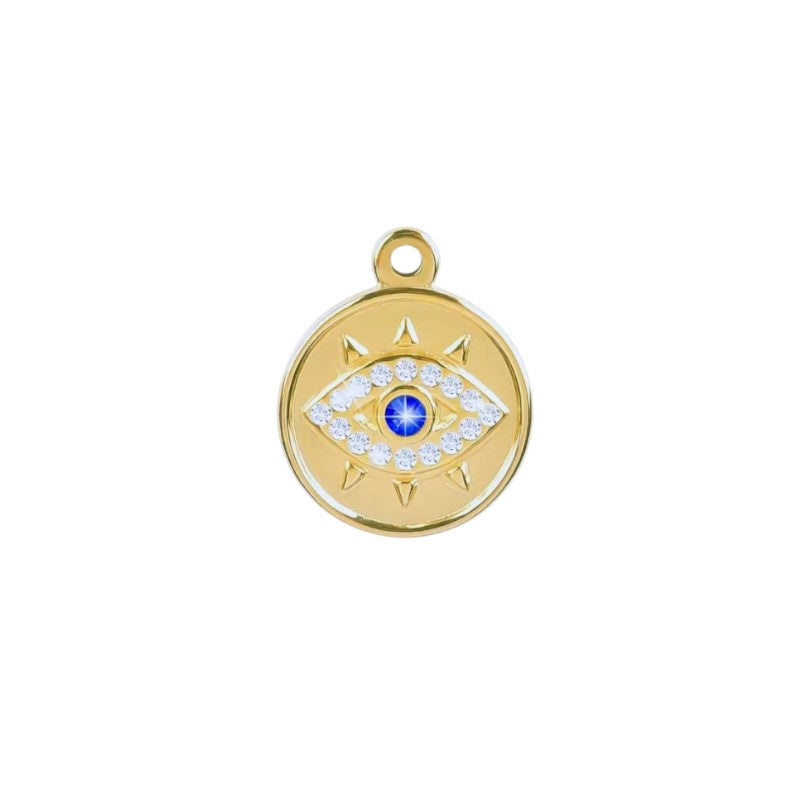 Gold pendant with eye design and blue gemstone on a white background