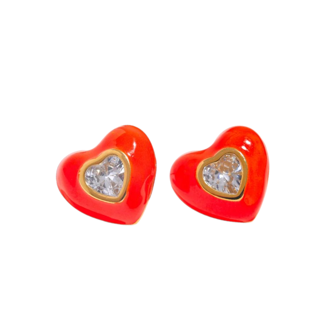 Heart-shaped earrings with tangerine enamel and clear gemstones on a white background