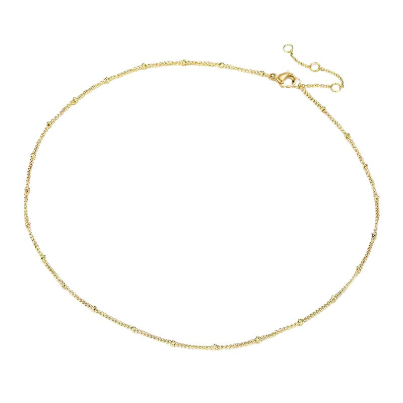 Gold  satellite chain necklace on a white background