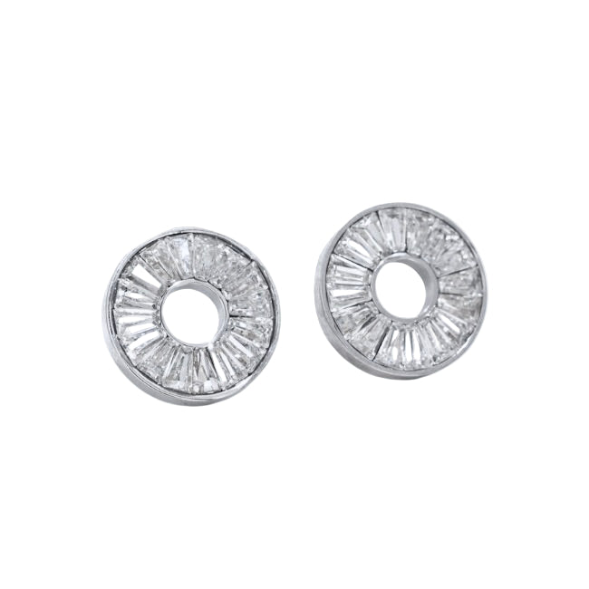 Pair of silver earrings with clear gemstones on a white background