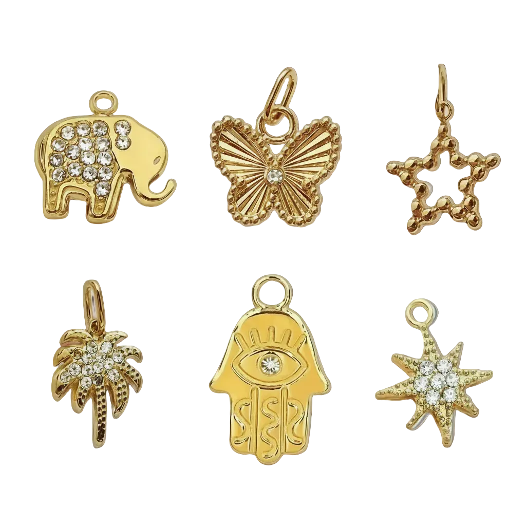 Set of gold charms including an elephant, butterfly, star, palm tree, and hamsa hand on a white background.