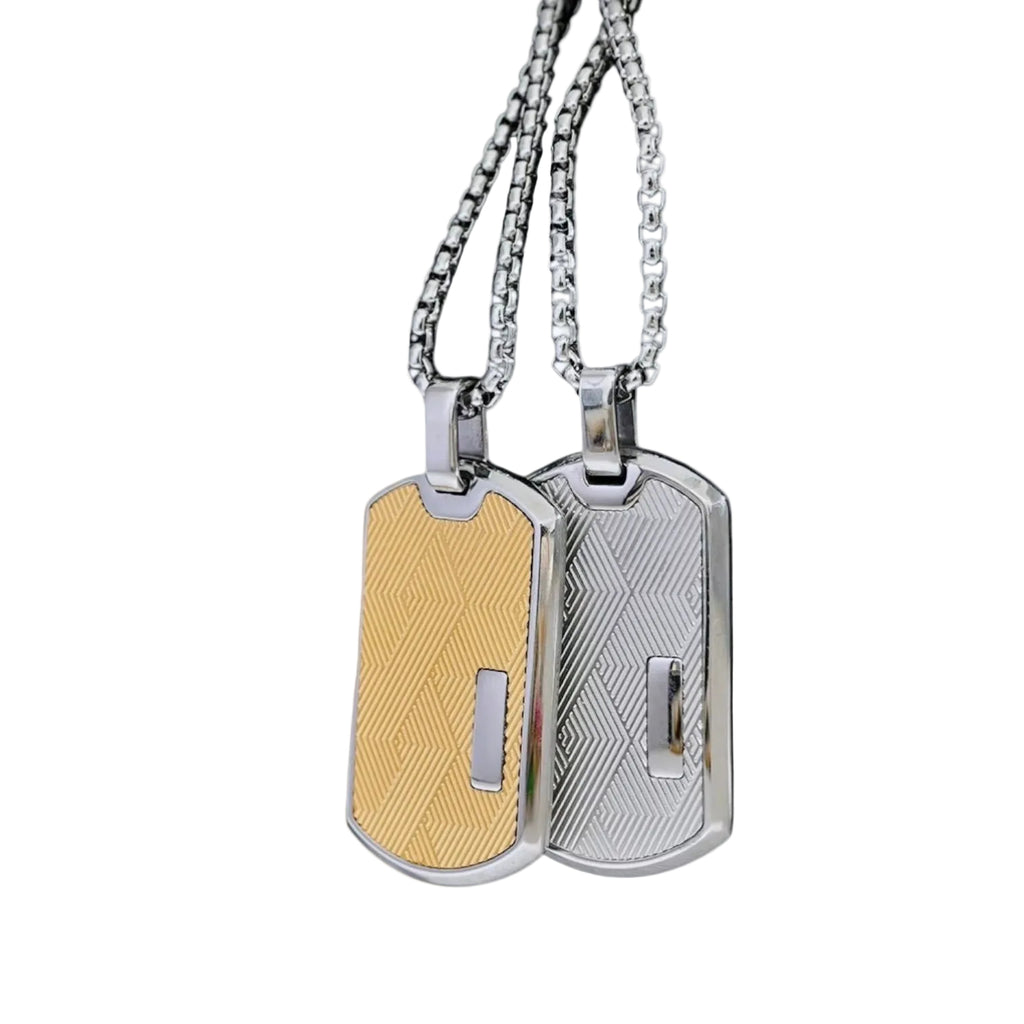 Two metallic dog tags on chains against a white background