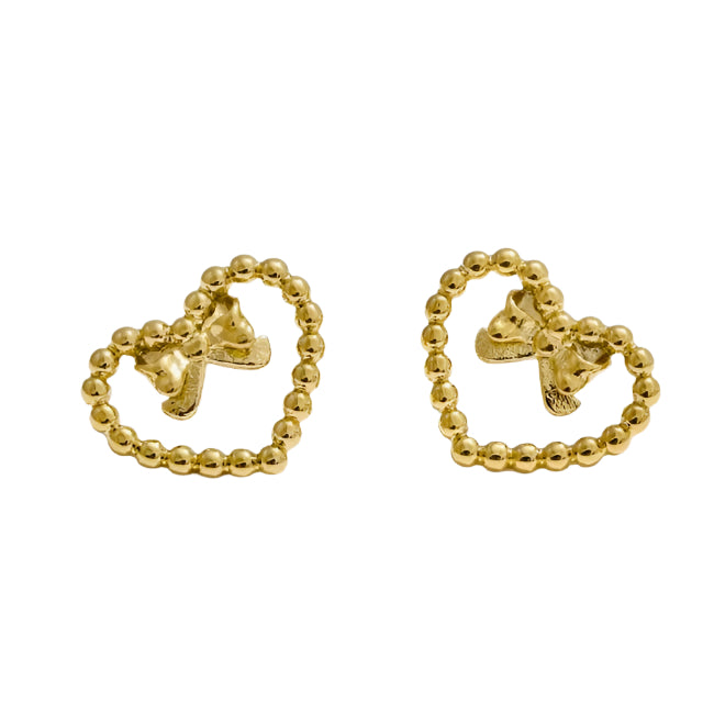 Gold stud earrings with bow designs on a light blue background