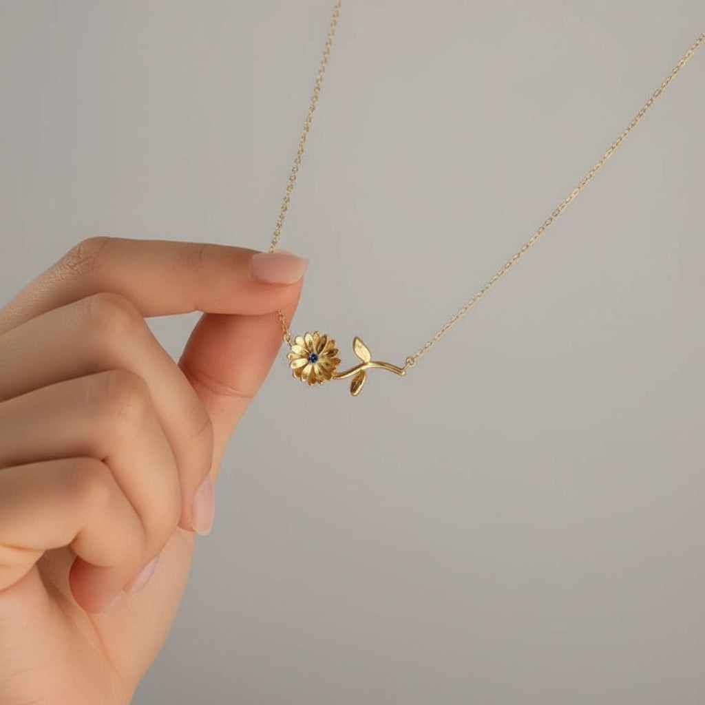 Gold necklace with a floral zodiac  pendant